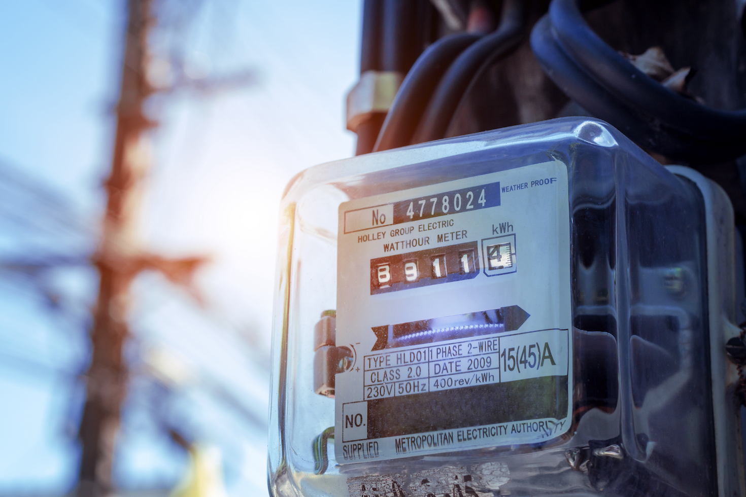 Electric meter on an outside utility pole.