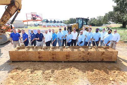 Group photo of construction and utility officials with shovels at Harpool Plant groundbreaking ceremony.